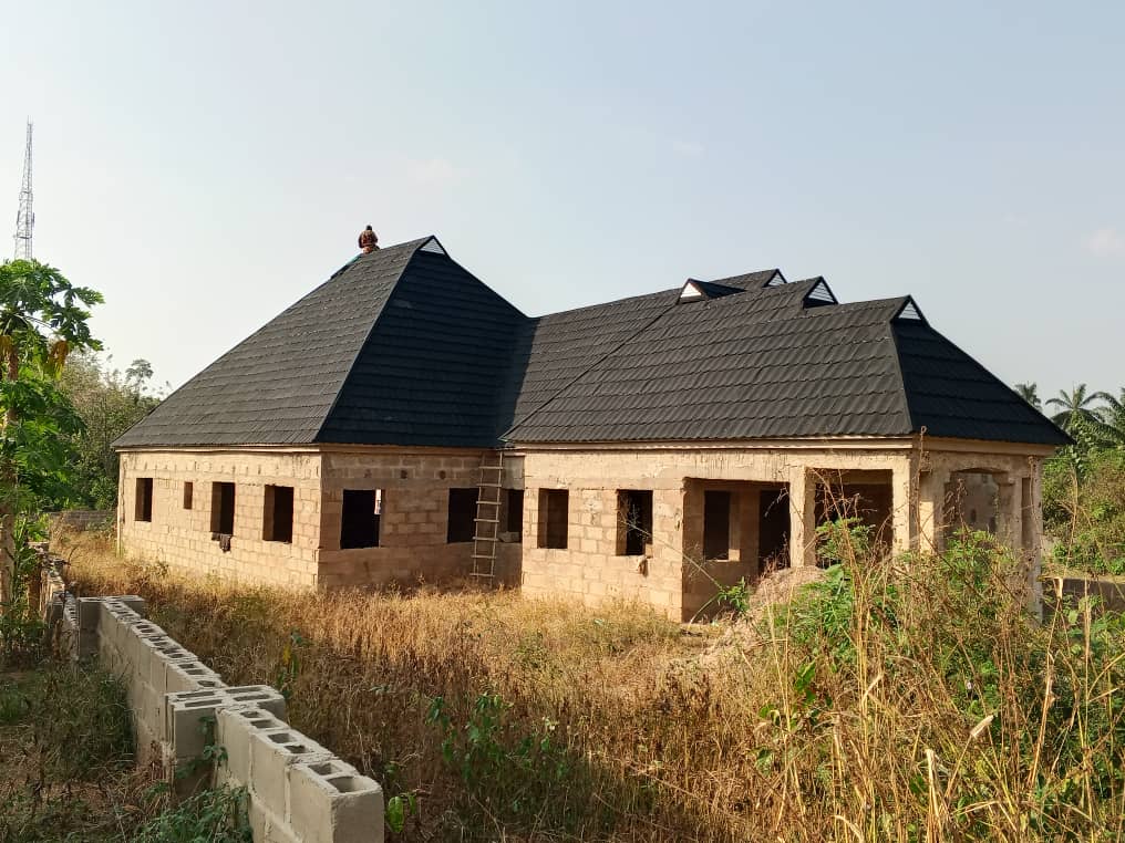 Completed Roofwell residential roof with dark stone-coated tiles